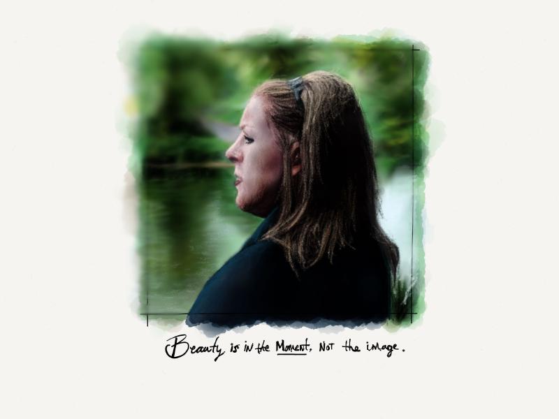 Digital watercolor and pencil portrait of a woman from the side. Her hair is pushed up with a headband as she looks off into the distance with a bokeh blurring out the trees and river behind her. The words Beauty is in the moment, not the image are written in ink below.