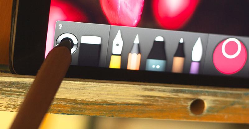 Wooden Pencil stylus touching the sync button in Paper’s tool tray on iPad.