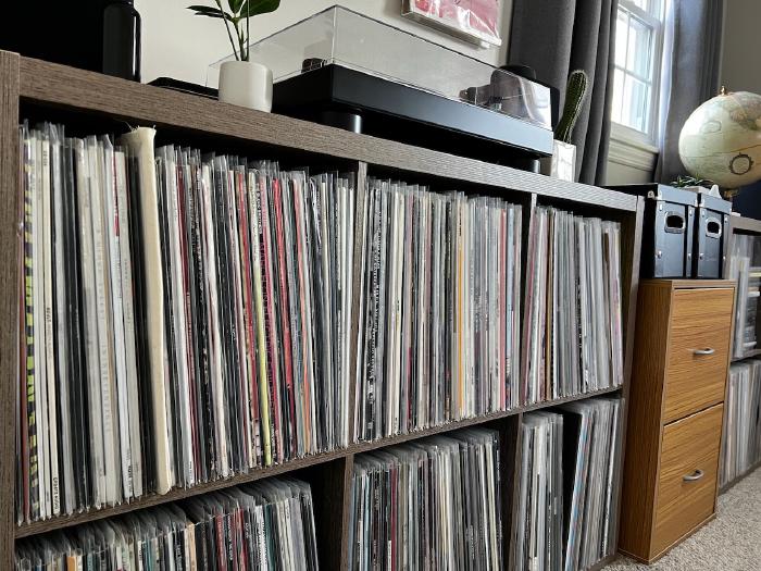 Audio Technica turntable and 800 records stored in cubed shelves.
